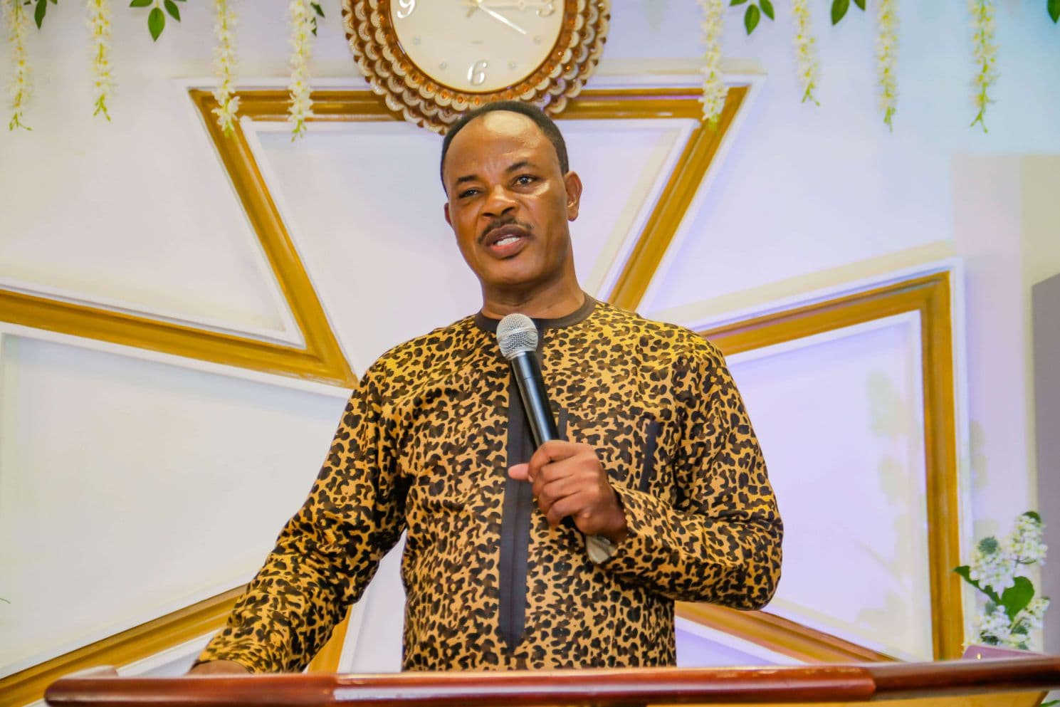 Church founder speaking at the pulpit
